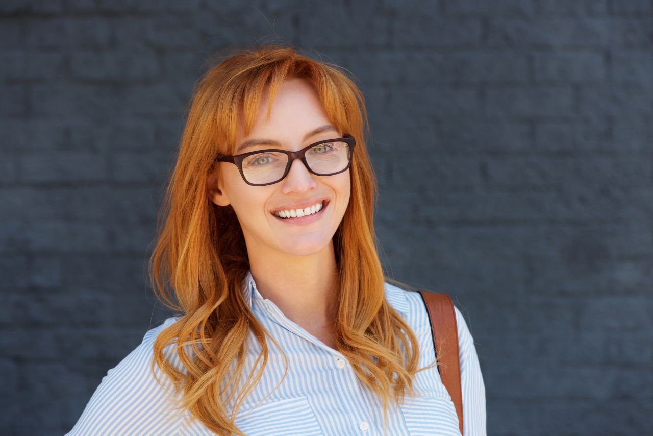 happy-business-woman-with-glasses-97kcsnd-1583410335.jpg