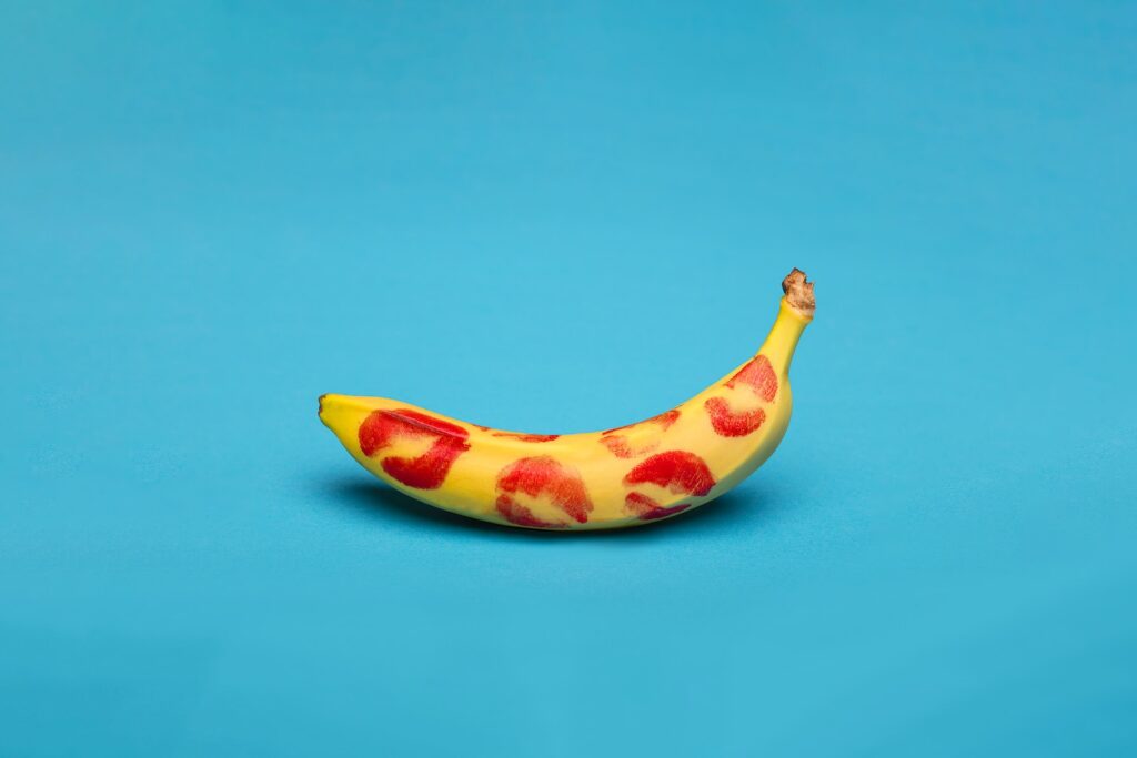 yellow banana fruit on blue surface